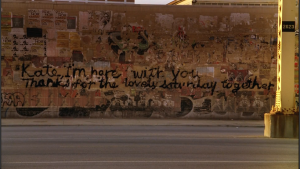 It's unclear whether Alex's disembodied hand appeared in the future and wrote on this wall.